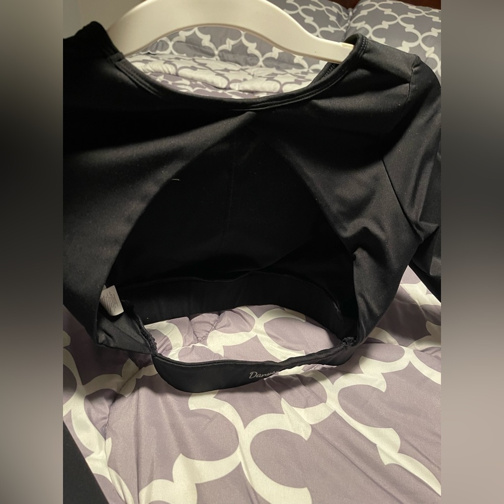 Cropped long sleeve workout top. Back is completely open.